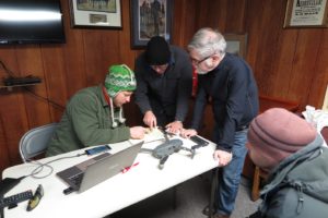 (Left to right) Professors Daniel Krebs (History) and DJ Biddle (Geography & Geosciences), with Vince DeNoto, director of the National Center for Geospatial Excellence at Jefferson Community & Technical College, planning the flight path of the drone over the battlefield.