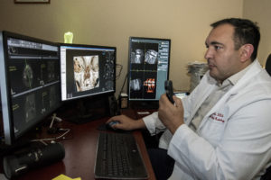 Bruno Azevedo, D.D.S., M.S., works with 3D digital data system