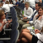 Vida Vaughn, Kornhauser clinical librarian, interacts with dental students during a seminar break.