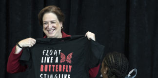 Justice Kagan shows off a t-shirt given to her during her Louisville visit.