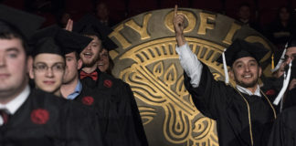 Nearly 1,000 graduates took part in the Dec. 15 commencement ceremony at the KFC Yum! Center.