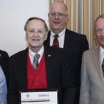 Larry Tyler, center, was recently recognized for 55 years of teaching in the Speed School.