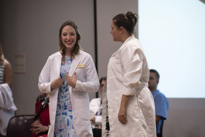 Future doctors receive their first white coat at UofL