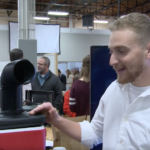 Mechanical engineering student Tyler Lampart presents his cooler-air conditioner prototype during Capstone showcase.