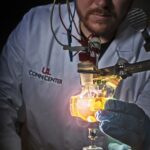 UofL chemistry graduate student Jacob Strain conducts a catalysis experiment at the Conn Center. UofL photo by Tom Fougerousse.