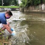 UofL student Sam Kessler using the water testing tool