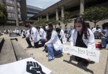 Medical students, residents and faculty take part in White Coats for Black Lives