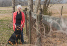 Woman standing with dog