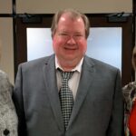 University of Lou8isville Professor Mark Running, center, was awarded the UofL Trustees Award for his ongoing commitment to student development. Rictured with Running are UofL Interim President Lori Stewart Gonzalez, left, and Board of Trustees Chair Mary Nixon.