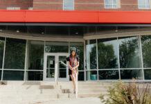 Shraddha Patel smiles outside the Cultural and Equity Center building on campus