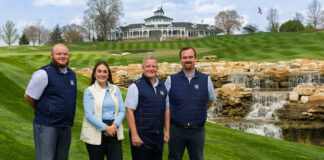 3 men and a woman on a golf course