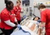 UofL nursing students work in the simulation lab.