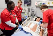 UofL nursing students work in the simulation lab.