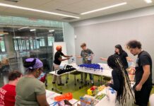 UofL students sort supplies as part of a five-day alternative service break in Chicago focused on environmental and housing justice.