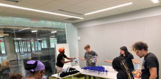 UofL students sort supplies as part of a five-day alternative service break in Chicago focused on environmental and housing justice.