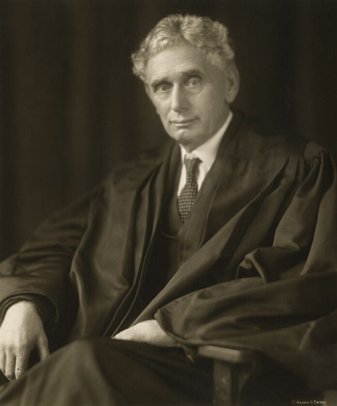 Pictured: Justice Louis D. Brandeis in his judicial robe, sometime between 1916 and 1939. Photograph by Harris and Ewing, collection of the Supreme Court of the United States.