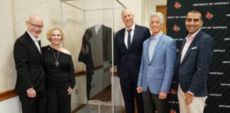 UofL administrators and family members of Louis D. Brandeis stand by the case containing the robe worn by namesake of UofL Law School, U.S. Supreme Court Justice Louis D. Brandeis.