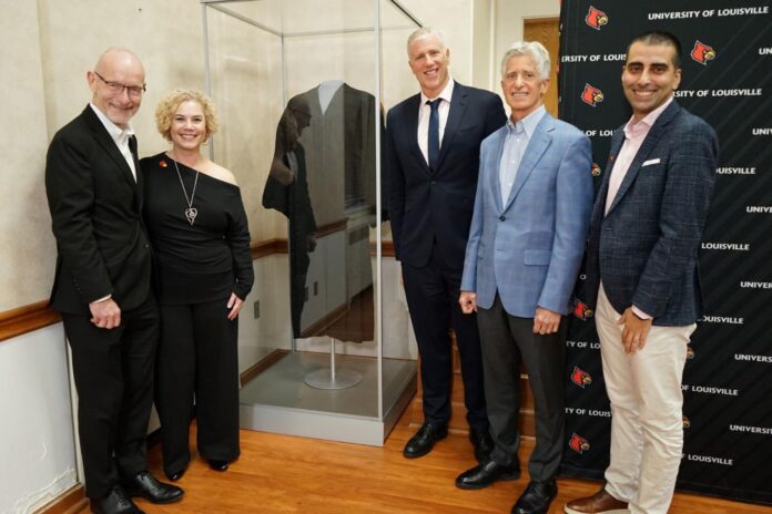 UofL administrators and family members of Louis D. Brandeis stand by the case containing the robe worn by namesake of UofL Law School, U.S. Supreme Court Justice Louis D. Brandeis.