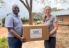 Rochelle Holm, UofL associate professor in the Christina Lee Brown Envirome Institute, and Petros Chigwechokha, head of the Department of Biological Sciences at Malawi University of Science and Technology, received a shipment of medical and research supplies thanks to SOS International in Louisville.