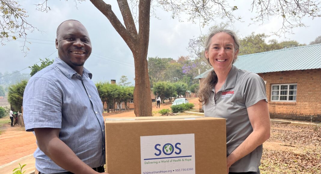 Rochelle Holm, UofL associate professor in the Christina Lee Brown Envirome Institute, and Petros Chigwechokha, head of the Department of Biological Sciences at Malawi University of Science and Technology, received a shipment of medical and research supplies thanks to SOS International in Louisville.