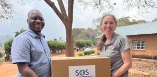 Rochelle Holm, UofL associate professor in the Christina Lee Brown Envirome Institute, and Petros Chigwechokha, head of the Department of Biological Sciences at Malawi University of Science and Technology, received a shipment of medical and research supplies thanks to SOS International in Louisville.