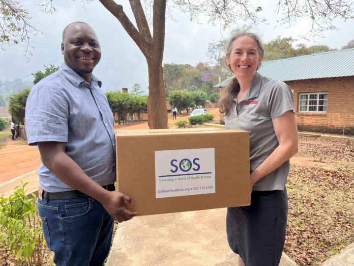 Rochelle Holm, UofL associate professor in the Christina Lee Brown Envirome Institute, and Petros Chigwechokha, head of the Department of Biological Sciences at Malawi University of Science and Technology, received a shipment of medical and research supplies thanks to SOS International in Louisville.