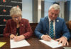 UofL President Kim Schatzel and KCTCS president Ryan Quarles sign an expanded transfer agreement on Dec. 9, 2024.