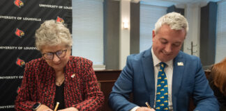 UofL President Kim Schatzel and KCTCS president Ryan Quarles sign an expanded transfer agreement on Dec. 9, 2024.