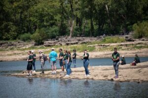 A group of anglers fish at Falls of the Ohio State Park