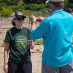 Woman taking part in fishing event