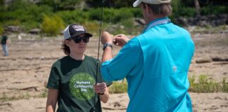 Woman taking part in fishing event