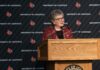 President Schatzel stands at a podium and speaks with an audience at Strickler Hall.