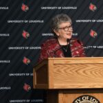 President Schatzel stands at a podium and speaks with an audience at Strickler Hall.