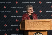 President Schatzel stands at a podium and speaks with an audience at Strickler Hall.