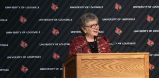 President Schatzel stands at a podium and speaks with an audience at Strickler Hall.