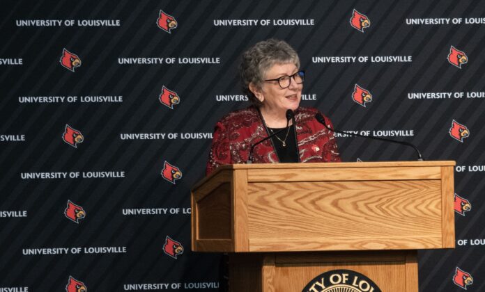 President Schatzel stands at a podium and speaks with an audience at Strickler Hall.