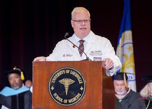 Man talking at the podium.