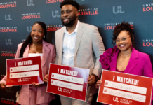 UofL medical students hold signs announcing their residency program placements.